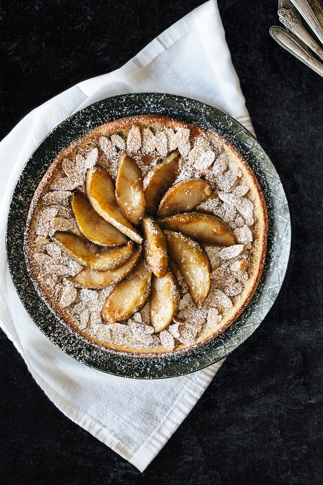 DUTCH BABY POPOVER PANCAKE WITH CARAMELIZED PEARS AND TOASTED ALMONDS